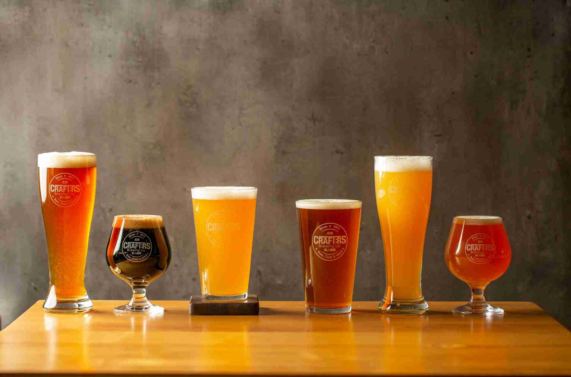A selection of craft beers in glasses on a table
